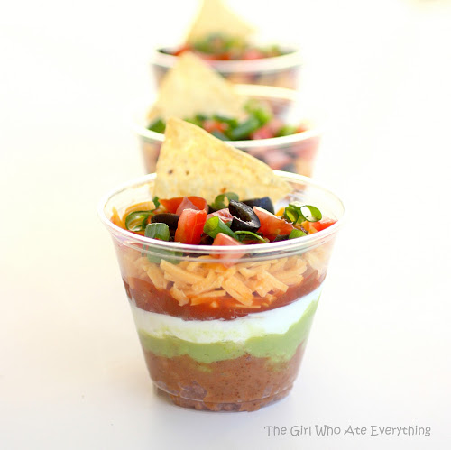 These Individual Seven-Layer Dips are individually portioned dips perfect for parties and get togethers. No double dipping here! the-girl-who-ate-everything.com
