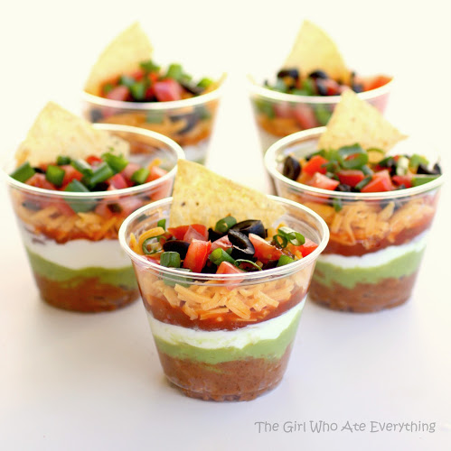 These Individual Seven-Layer Dips are individually portioned dips perfect for parties and get togethers. No double dipping here! the-girl-who-ate-everything.com