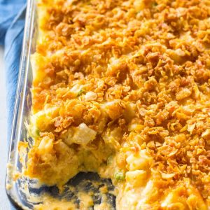 Gooey Potatoes - creamy, cheesy potatoes topped with buttery crunchy cornflakes. Some people call these funeral potatoes but this name is much less morbid. the-girl-who-ate-everything.com