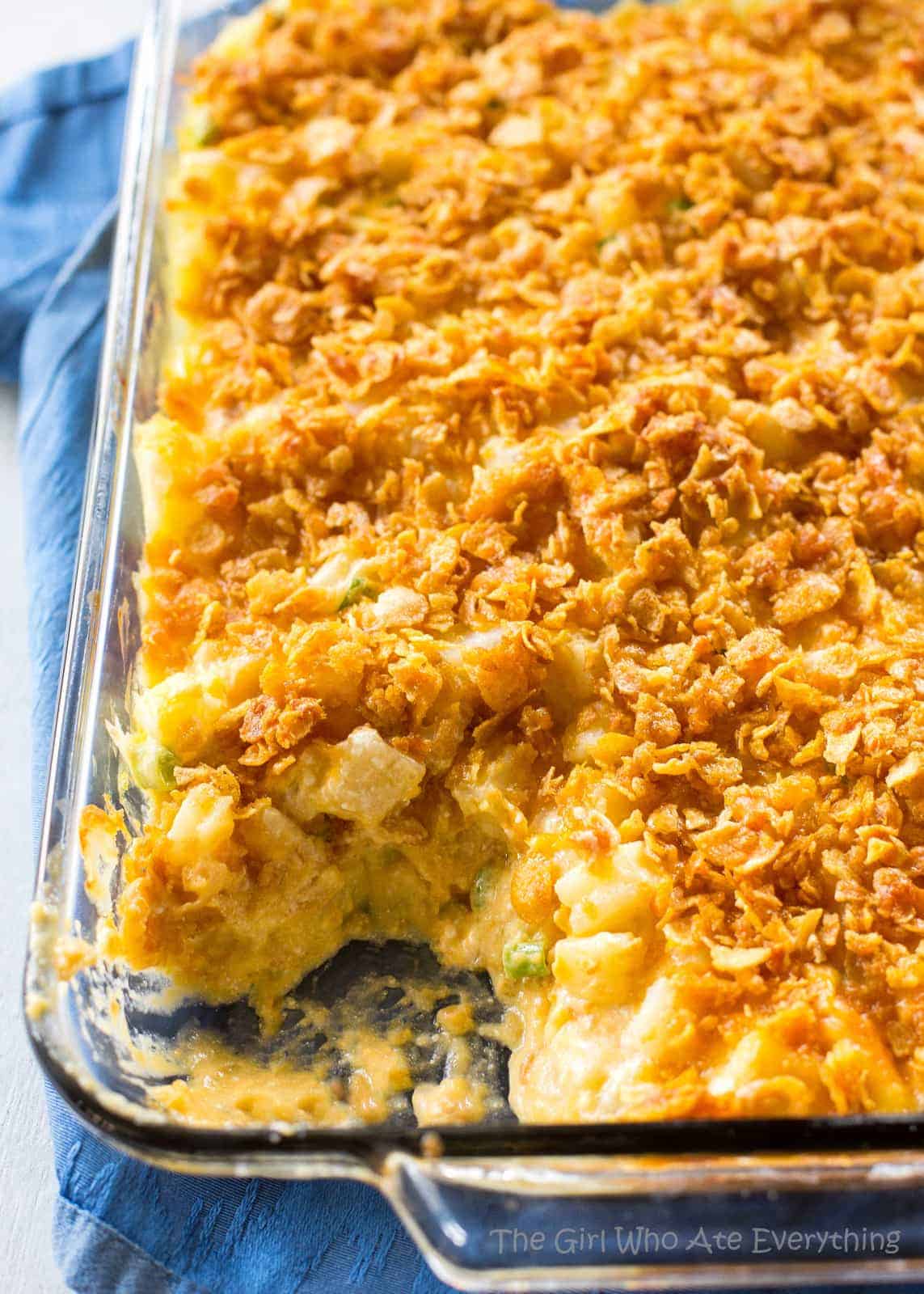 Funeral Potatoes - creamy, cheesy potatoes topped with buttery crunchy cornflakes. These are always a hit at get togethers. #funeral #potatoes #sides #dish #recipe #potluck