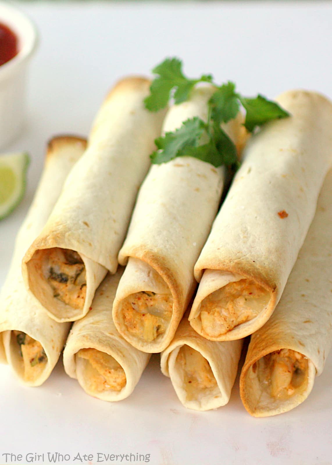 Baked Creamy Chicken Taquitos - one of my favorite go-to Mexican appetizers or meal. the-girl-who-ate-everything.com