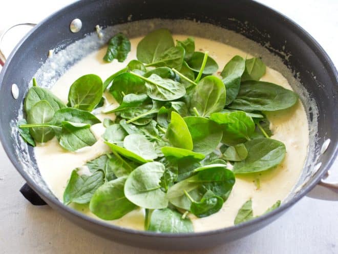 cream and spinach in a pan