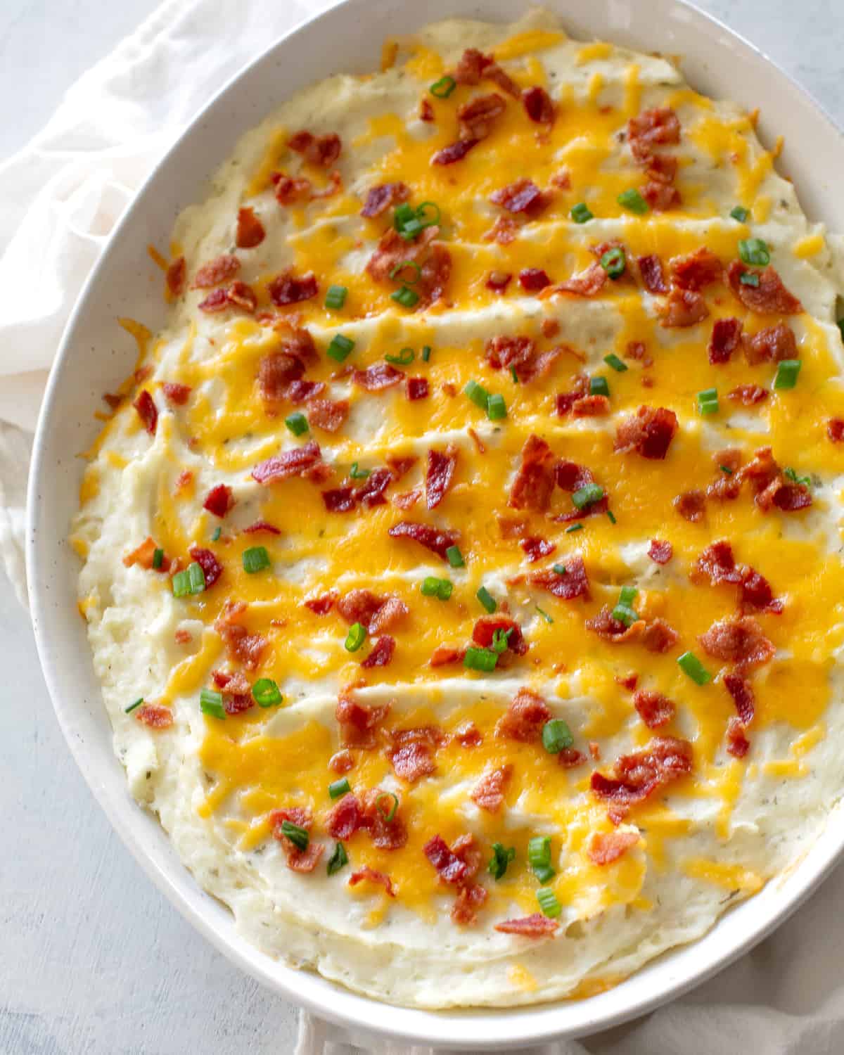 potatoes with cheese, bacon, and green onions