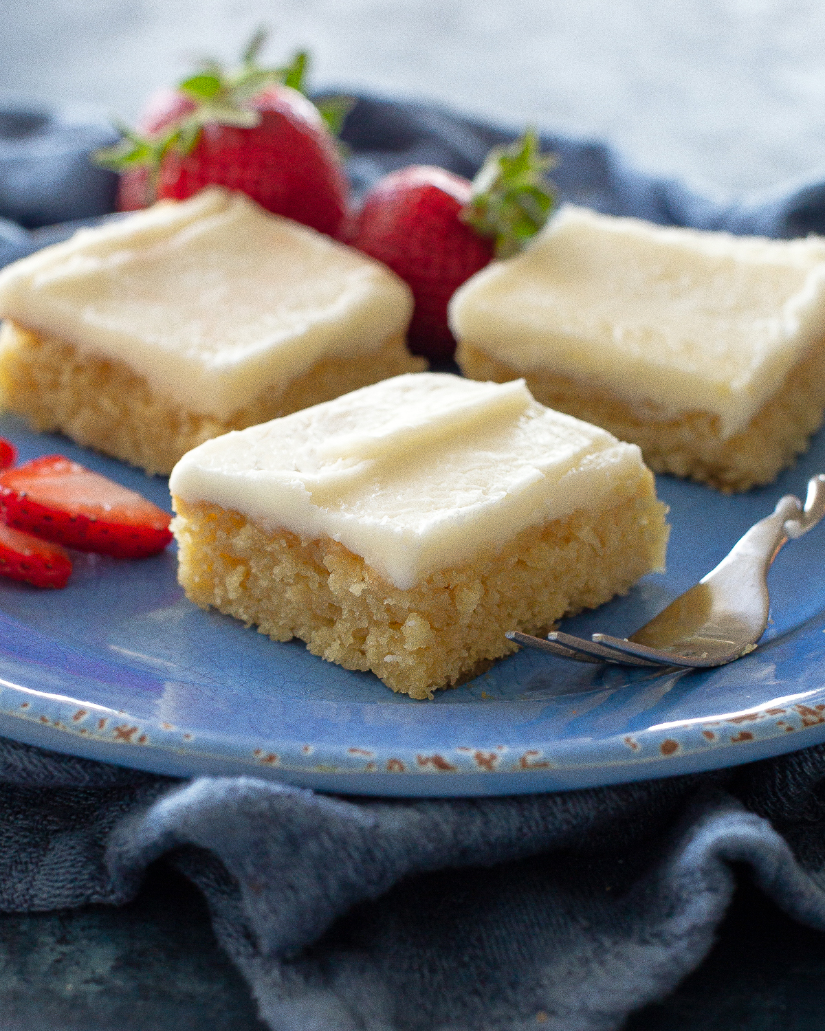 White Texas Sheet Cake is a great cake for feeding a crowd. Buttery, moist, and covered in an almond flavored frosting, this cake is a tried and true recipe. #white #texas #sheet #cake #recipe
