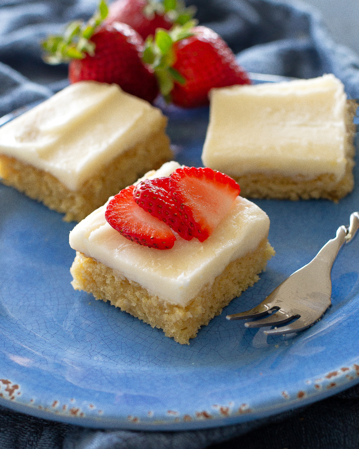 White Texas Sheet Cake is a great cake for feeding a crowd. Buttery, moist, and covered in an almond flavored frosting, this cake is a tried and true recipe. #white #texas #sheet #cake #recipe