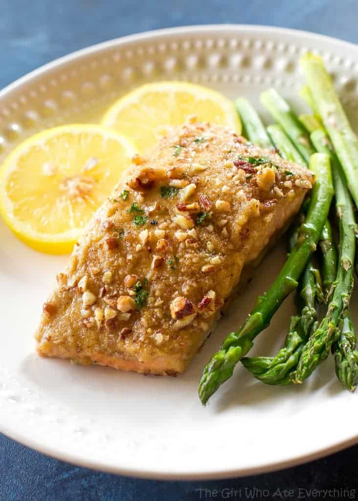 Baked Dijon Salmon - salmon topped with honey, dijon mustard, pecans, and breadcrumbs. An easy weeknight dinner. the-girl-who-ate-everything.com