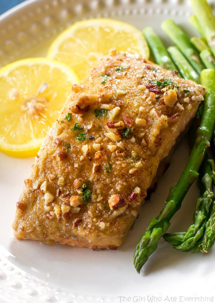 Baked Dijon Salmon - salmon topped with honey, dijon mustard, pecans, and breadcrumbs. An easy weeknight dinner. the-girl-who-ate-everything.com