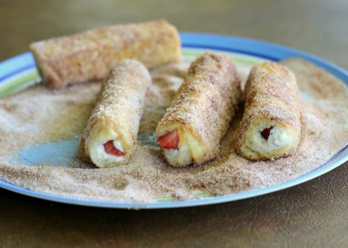 French Toast Roll-Ups - cream cheese, fruit, or whatever fillings you like rolled up in cinnamon sugar bread. the-girl-who-ate-everything.com