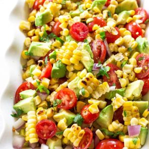 Corn Avocado and Tomato Salad - a healthy and light salad perfect for BBQs and get togethers. the-girl-who-ate-everything.com