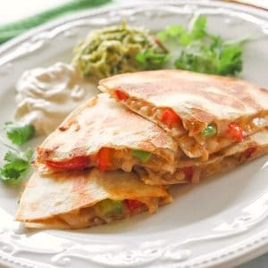 Fajita Quesadillas - Tortillas are filled with seasoned veggies and lots of cheese. A quick dinner for any night of the week. {The Girl Who Ate Everything}