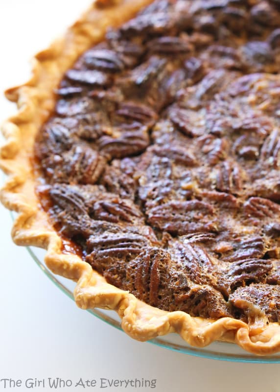 Chocolate Pecan Pie - inspired from the delicious pie from The Roaring Fork restaurant. This is a twist on the traditional pecan pie with chocolate chips and toffee bits inside. the-girl-who-ate-everything.com