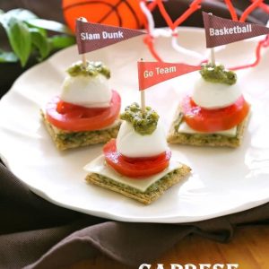 Caprese Triscuit Bites - A one bite appetizer perfect for the game. the-girl-who-ate-everything.com