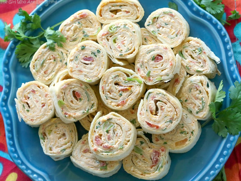 These Chicken Enchilada Roll Ups are a great appetizer for parties! Easy to make ahead and easy to serve. the-girl-who-ate-everything.com