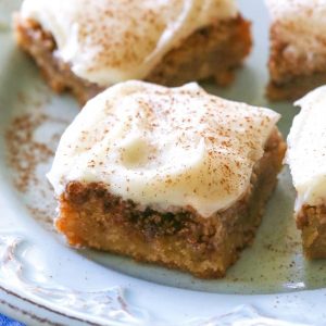 Cinnamon Roll Blondies - blondies with brown sugar and cinnamon swirled in and topped with cream cheese frosting. The yummy flavors of a cinnamon roll without the trouble of yeast. the-girl-who-ate-everything.com