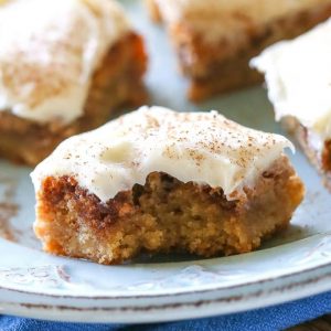 Cinnamon Roll Blondies - blondies with brown sugar and cinnamon swirled in and topped with cream cheese frosting. The yummy flavors of a cinnamon roll without the trouble of yeast. the-girl-who-ate-everything.com