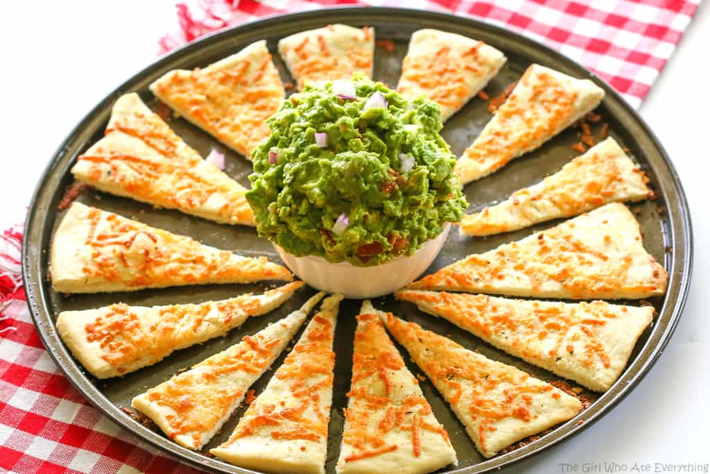 An Italian guacamole made with basil, garlic, avocado, red onions, and tomato. Instead of chips, super thin pizza crust strips are used. A knock-off from one of our favorite restaurant appetizers. the-girl-who-ate-everything.com
