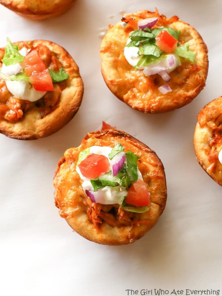 Chicken Taco Cupcakes - biscuits filled with taco chicken, cheese, and all your taco fixings. the-girl-who-ate-everything.com