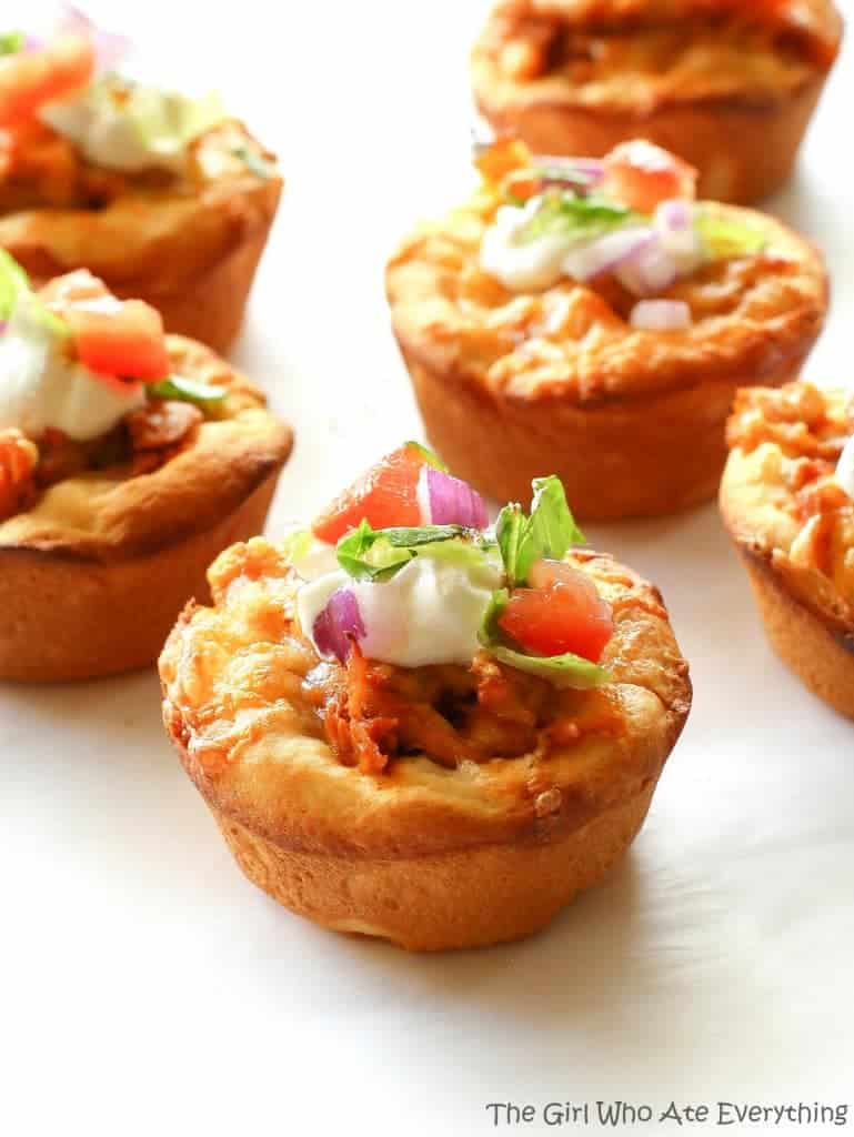 Chicken Taco Cupcakes - biscuits filled with taco chicken, cheese, and all your taco fixings. the-girl-who-ate-everything.com