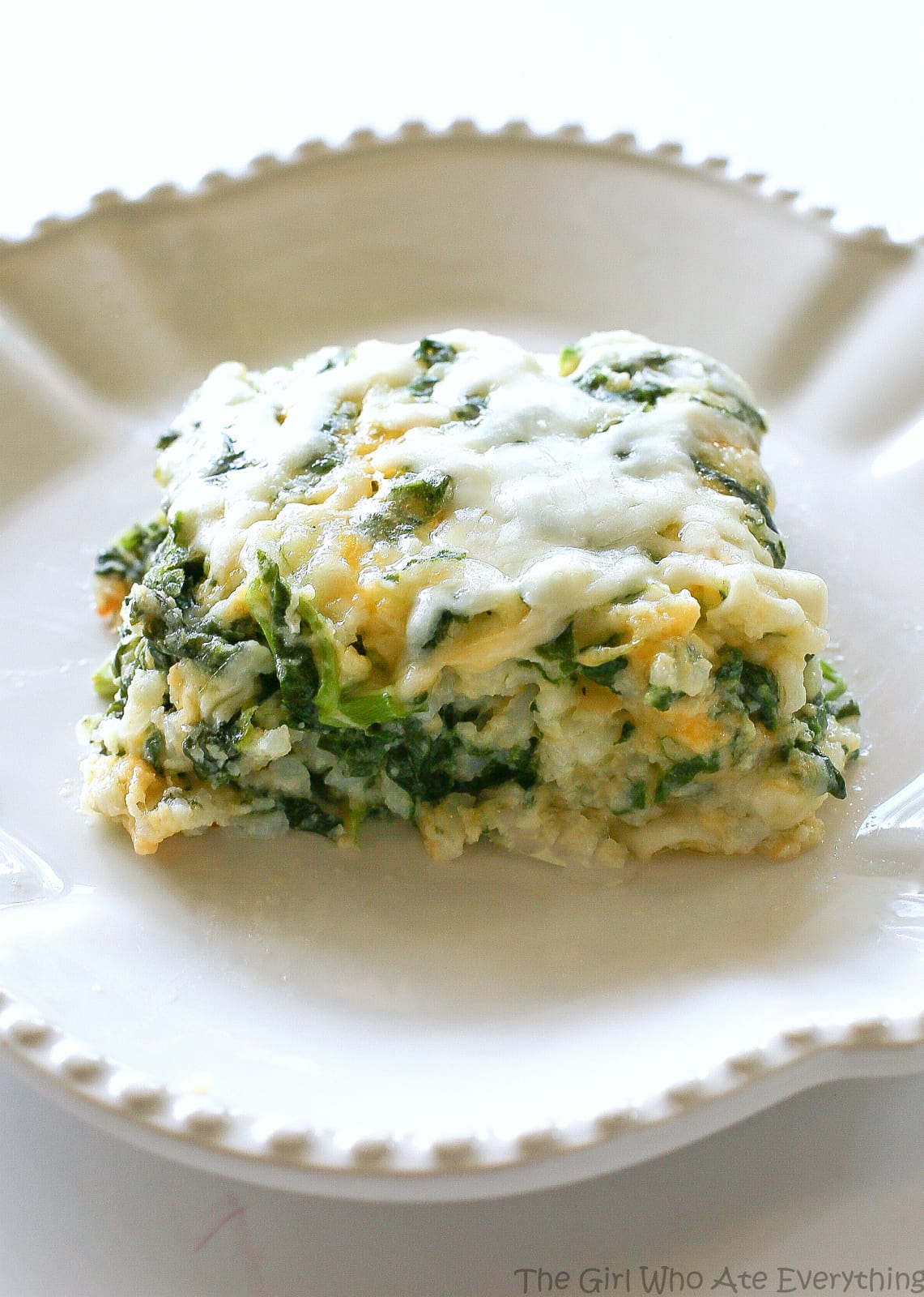 Spinach Parmesan Rice Bake - a cheesy side dish with spinach, cheese, and rice. the-girl-who-ate-everything.com