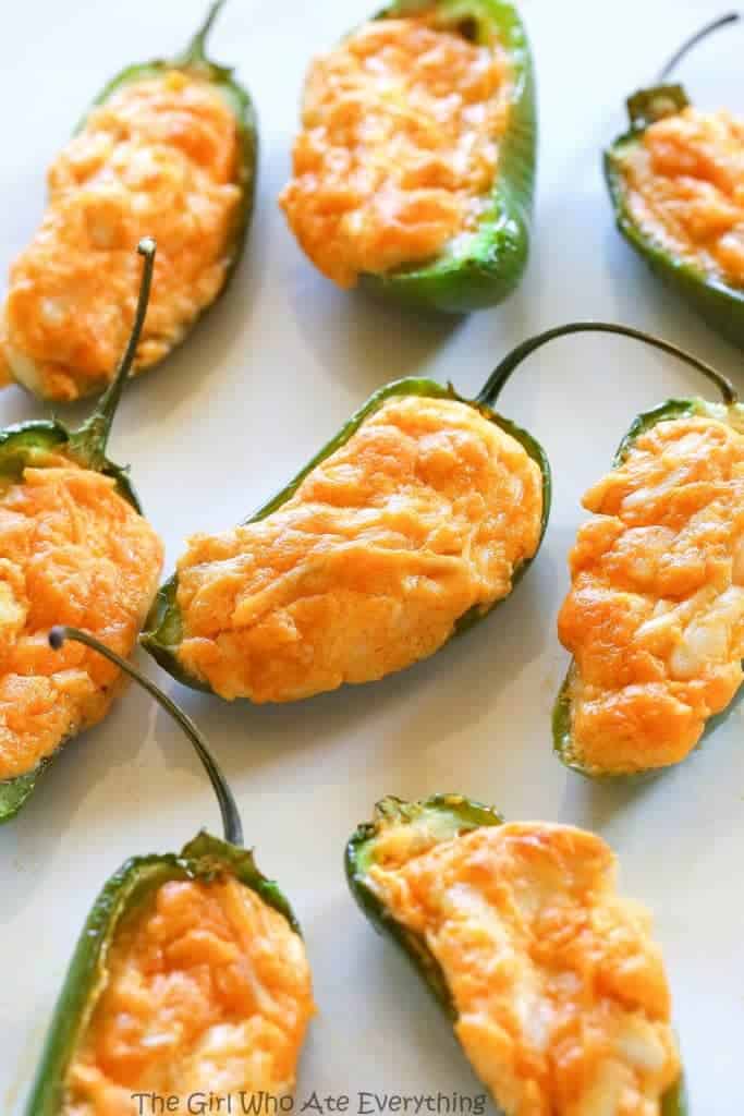 Buffalo Chicken Jalapeno Poppers - buffalo chicken dip meets jalapenos! Game food right here. the-girl-who-ate-everything.com
