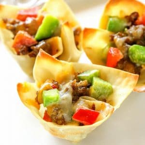 Sausage Wonton Stars - bite sized appetizers filled with sausage, peppers, cheese, and ranch dressing. the-girl-who-ate-everything.com