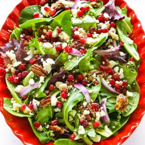 Pomegranate Feta Salad - this quick and easy salad is topped with a zesty vinaigrette! the-girl-who-ate-everything.com