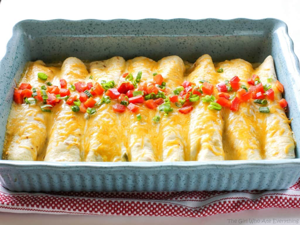 These Chorizo Breakfast Enchiladas are filled with eggs, chorizo, hash browns and topped with bacon! the-girl-who-ate-everything.com