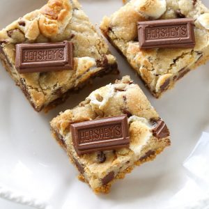 S'mores Cookie Bars - chocolate chip marshmallow cookie dough with a graham cracker crust. Seriously delicious. the-girl-who-ate-everything.com