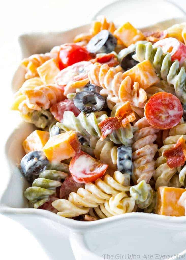 Bacon Ranch Pasta Salad - flavorful pasta salad with cheddar cheese, olives, tomatoes, and bacon. Covered in a creamy ranch sauce. the-girl-who-ate-everything.com