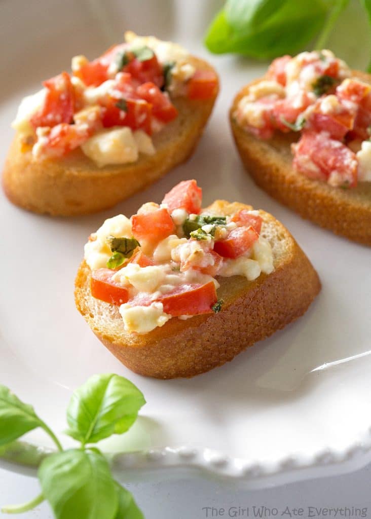 Tomato Feta Bruschetta - a flavor party in your mouth! An impressive appetizer that's so easy. the-girl-who-ate-everything.com