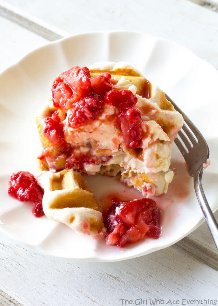 Strawberry Cheesecake Biscuit Waffles - strawberries and cream lathered on waffles made with biscuits! Tastes like strawberry shortcake! the-girl-who-ate-everything.com