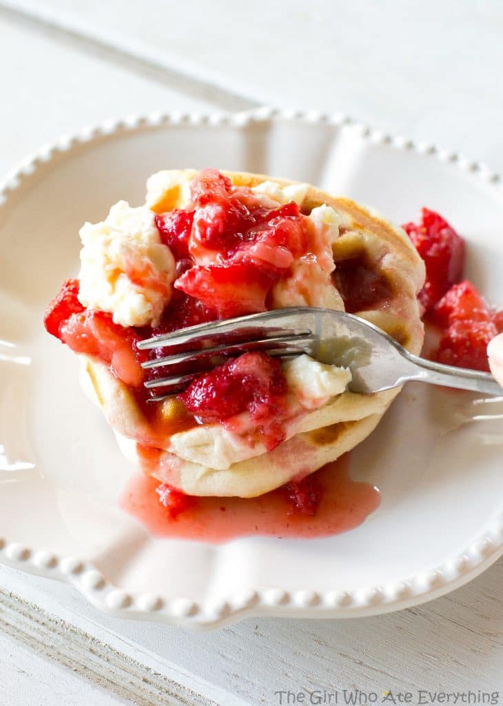 Strawberry Cheesecake Biscuit Waffles - strawberries and cream lathered on waffles made with biscuits! Tastes like strawberry shortcake! the-girl-who-ate-everything.com