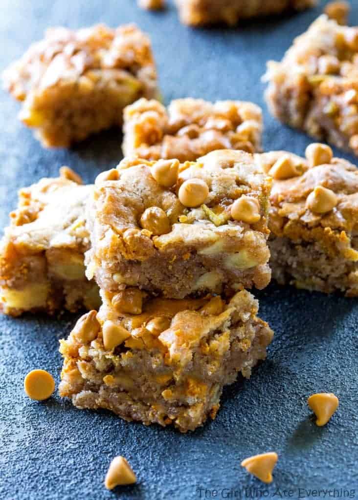 Apple Snack Squares - a dense apple and walnut square that is topped with butterscotch chips. the-girl-who-ate-everything.com
