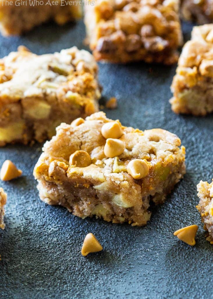 Apple Snack Squares - a dense apple and walnut square that is topped with butterscotch chips. the-girl-who-ate-everything.com