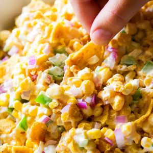 Frito Corn Salad - this is your game day recipe. Corn, Fritos, peppers, and onion. So good!