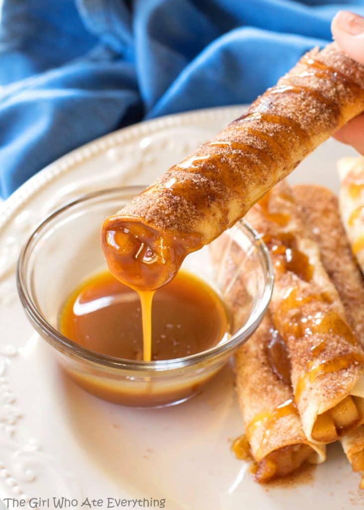Creamy Caramel Apple Taquitos - filled with cinnamon apples, caramel, and cream cheese, rolled in cinnamon sugar and drizzled with caramel. the-girl-who-ate-everything.com