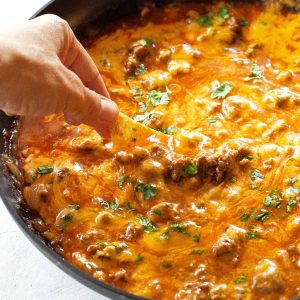 Beef Enchilada Dip - so easy! Always a crowd pleaser! the-girl-who-ate-everything.com