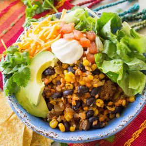 Riced Cauliflower and Sweet Potato Beef Burrito Bowls - a healthy version of your favorite burrito bowl! the-girl-who-ate-everything.com