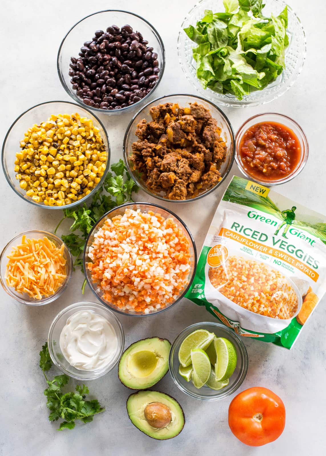Riced Cauliflower and Sweet Potato Beef Burrito Bowls - a healthy version of your favorite burrito bowl! the-girl-who-ate-everything.com