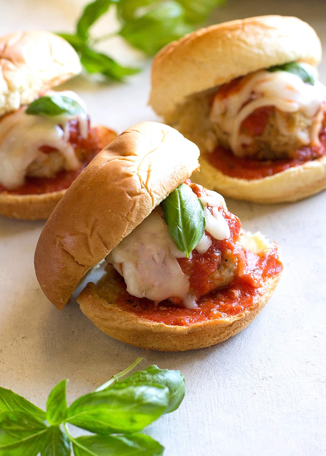 Chicken Parmesan Meatball Sliders - so easy and always a crowd pleaser. You can serve them as appetizers or dinner like I usually do! the-girl-who-ate-everything.com