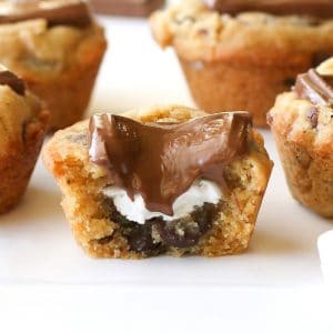S'mores Cups - bite sized graham cracker cookie cups filled with chocolate and marshmallows. the-girl-who-ate-everything.com