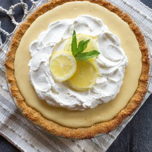 Magnolia's Lemon Pie - light, sweet and tart lemon pie with a thick graham cracker crust. From Joanna Gaines! the-girl-who-ate-everything.com
