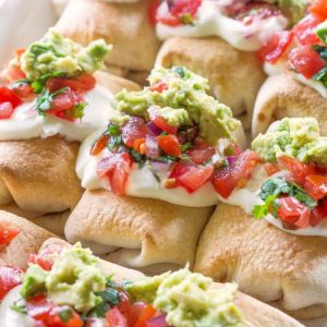 Mini Chicken Chimichangas - these mini Mexican appetizers are filled with creamy chicken and spicy Pepper Jack cheese. the-girl-who-ate-everything.com