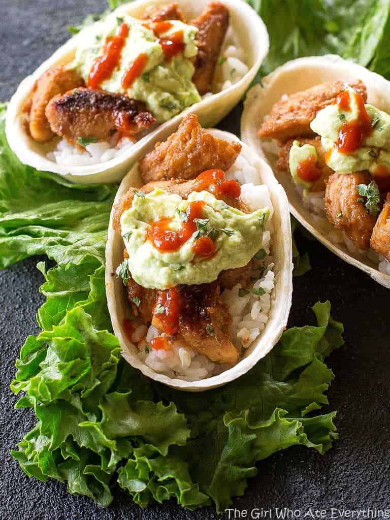 Mini Honey Sriracha Chicken Taco Boats - spicy and sweet chicken tacos topped with an avocado crema. the-girl-who-ate-everything.com