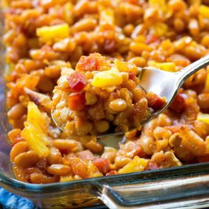 Hawaiian Baked Beans - sweet and salty with bits of ham throughout!. A great side for luaus or BBQs. the-girl-who-ate-everything.com