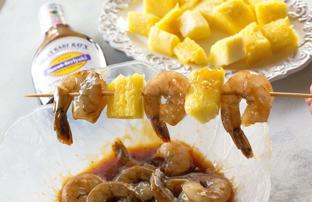 These Grilled Shrimp and Pineapple Skewers are served over coconut rice and have a sweet Teriyaki glaze. the-girl-who-ate-everything.com