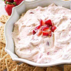 Strawberry Cheesecake Dip made with fresh strawberries and fresh whipped cream! the-girl-who-ate-everything.com
