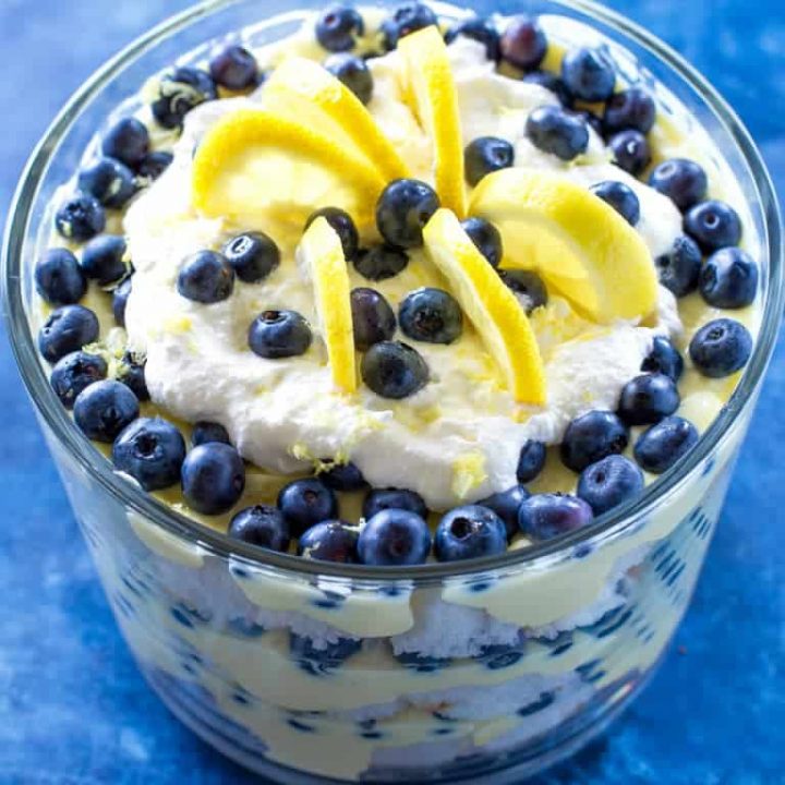 This Lemon Blueberry Trifle is layers of angel food cake, lemon pudding, and blueberries. A crowd pleasing dessert! the-girl-who-ate-everything.com