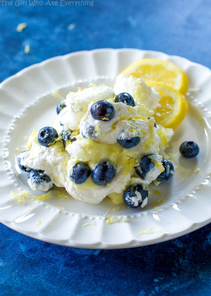 This Lemon Blueberry Trifle is layers of angel food cake, lemon pudding, and blueberries. A crowd pleasing dessert! the-girl-who-ate-everything.com