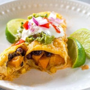 Sweet Potato and Black Bean Enchiladas - a vegetarian Mexican dinner that has the perfect amount of spice and flavor. This is a great freezer meal! the-girl-who-ate-everything.com